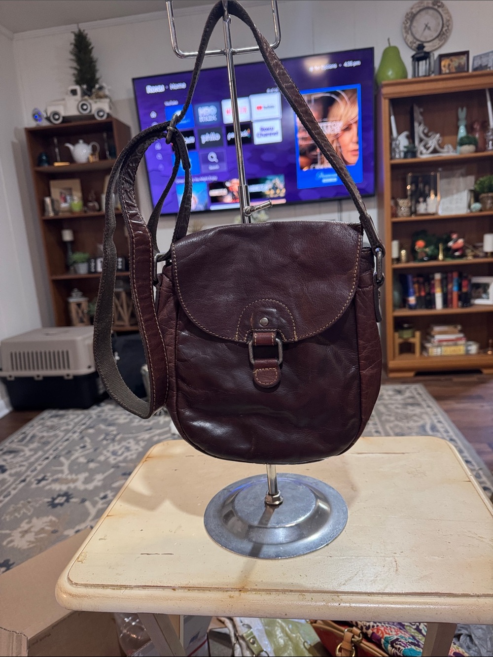 Brown leather Jack Georges Voyager crossbody saddle bag.